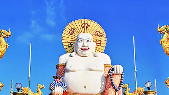 Golden Buddha statue at a temple on Koh Samui, symbolic image for Thailand's rules of conduct